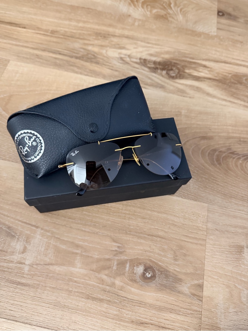 Ray-Ban women’s Gold Rimless Sunglasses with Gray Lenses